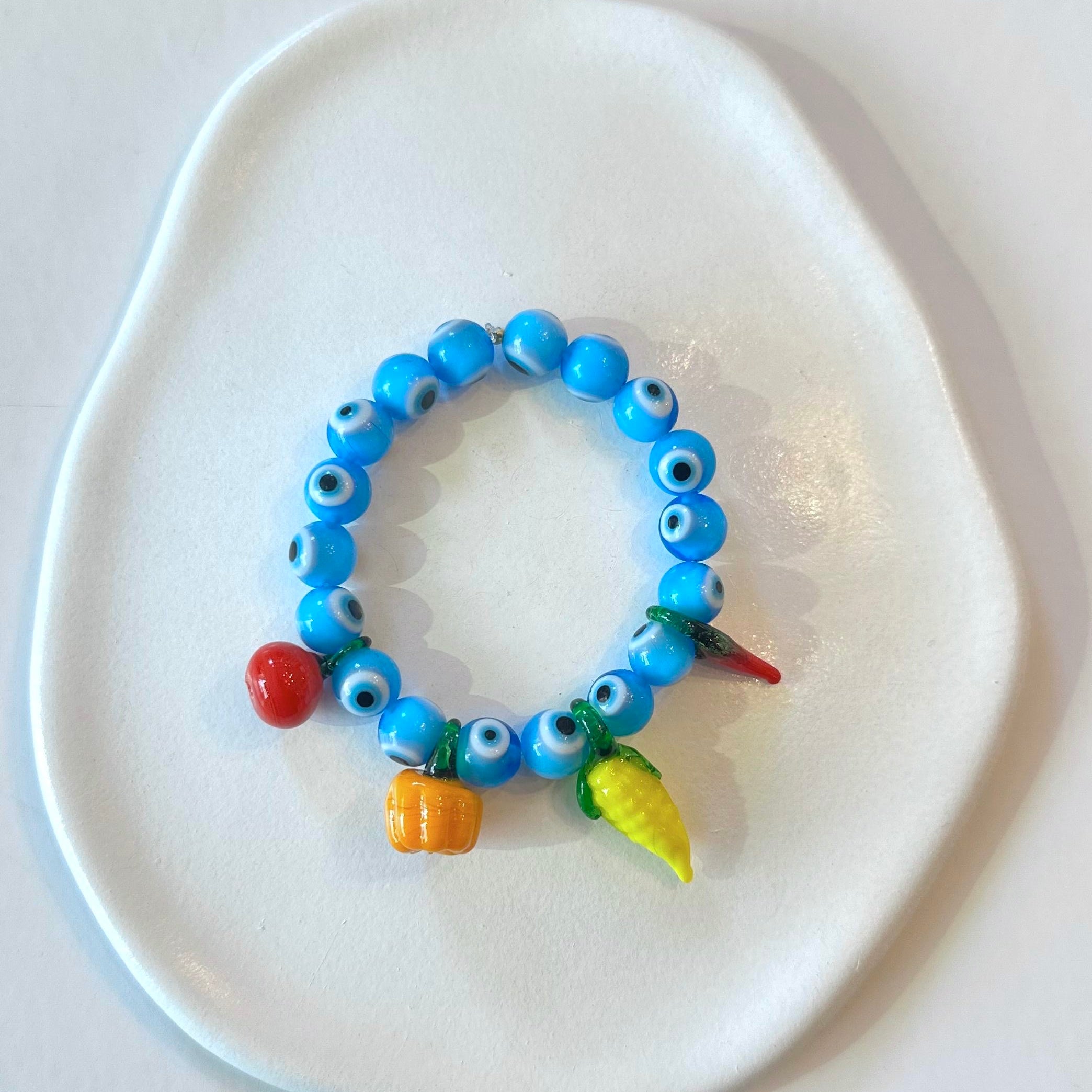 Glass fruits & evil eye bracelet