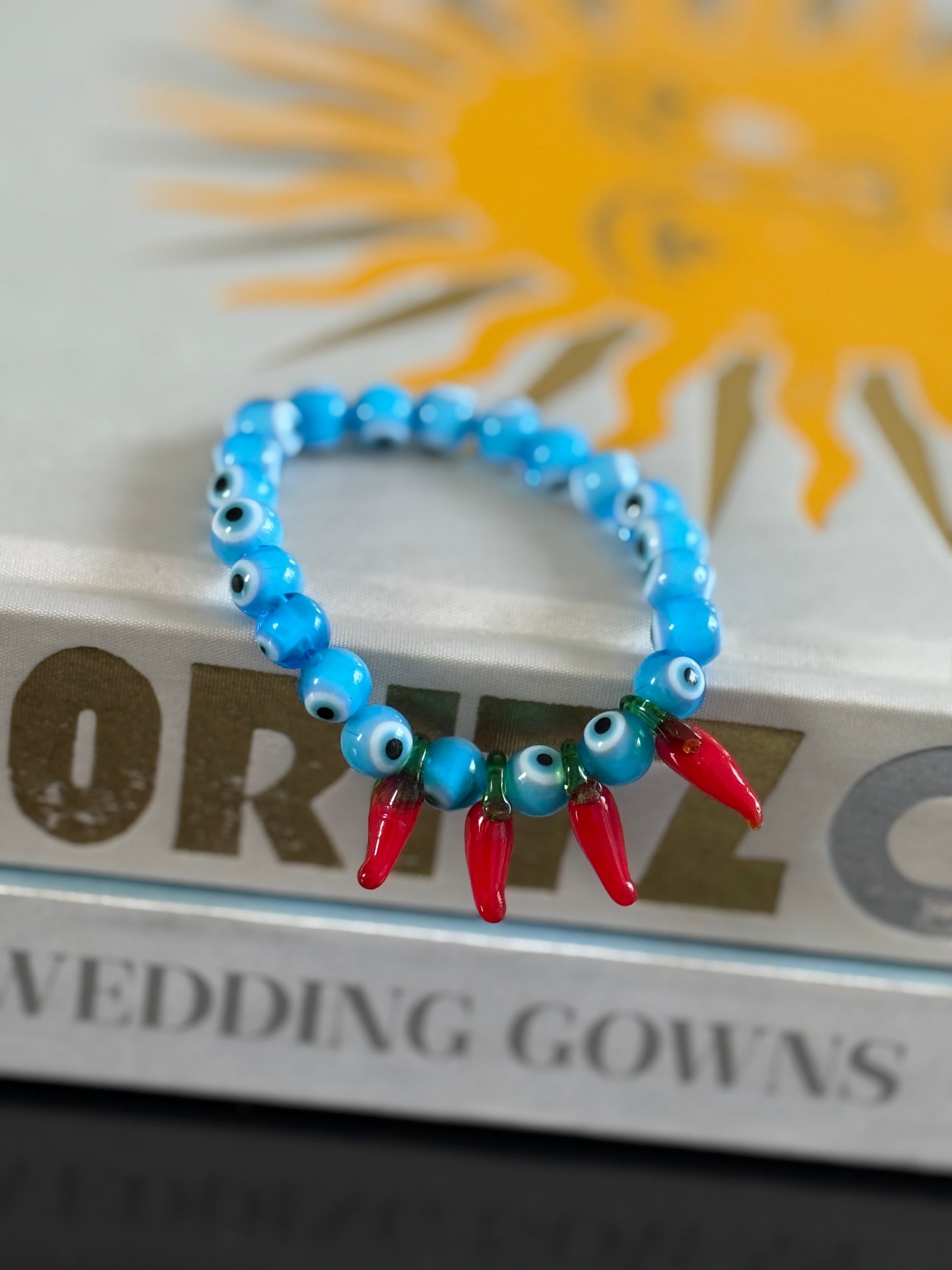 Protected red hot chilly bracelet