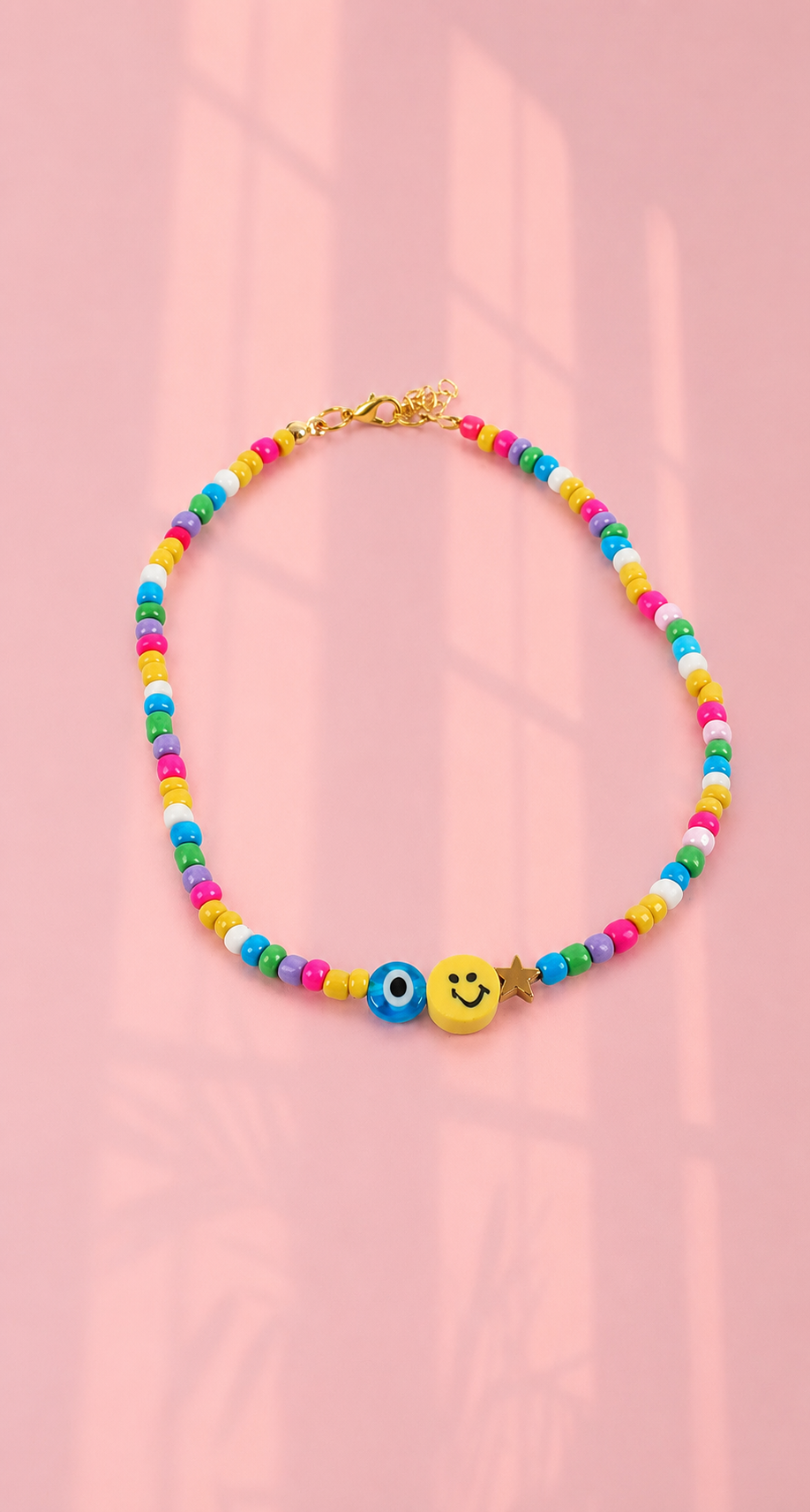 Yellow smiley / evil eye necklace