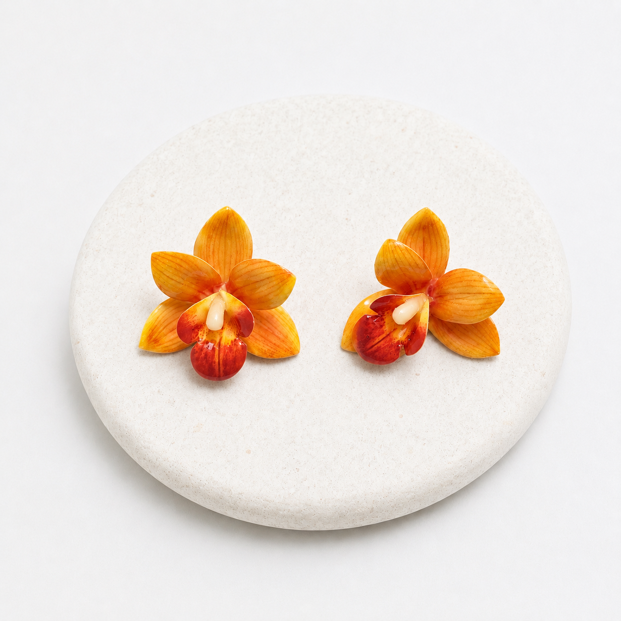 Orange orchid plastic earrings